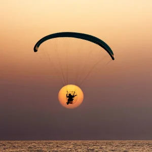 vacancesguadeloupe__person-parasailing-in-the-crystal-clear-waters-of-2026-03-18-16-04-34-utc
