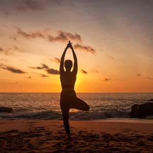 vacancesguadeloupe__silhouette-slim-woman-does-asana-yoga-position-arm-2026-01-09-06-56-28-utc