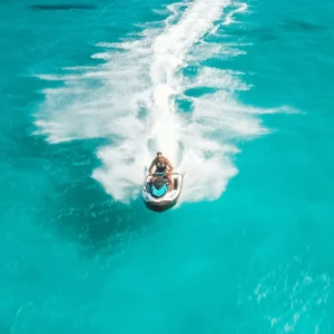 vacancesguadeloupe__view-of-a-person-riding-a-jet-ski-on-clear-turquoi-2026-01-07-23-45-08-utc