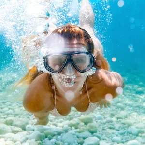 vacancesguadeloupe__woman-snorkeling-in-the-clear-sea-water-2026-01-05-23-14-18-utc